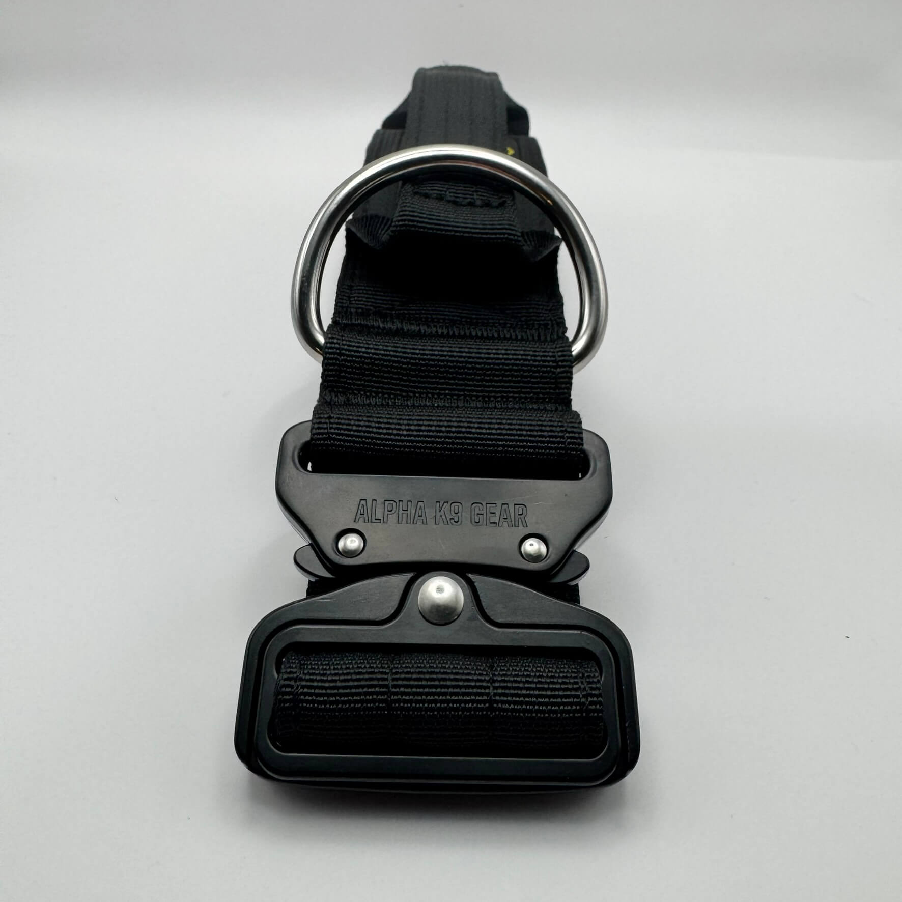 Official Alpha K9 Gear Black Tactical Dog Collar, featuring a signature heavy-duty quick-release metal buckle, reinforced control handle, and premium double-layered nylon engineered for large breeds