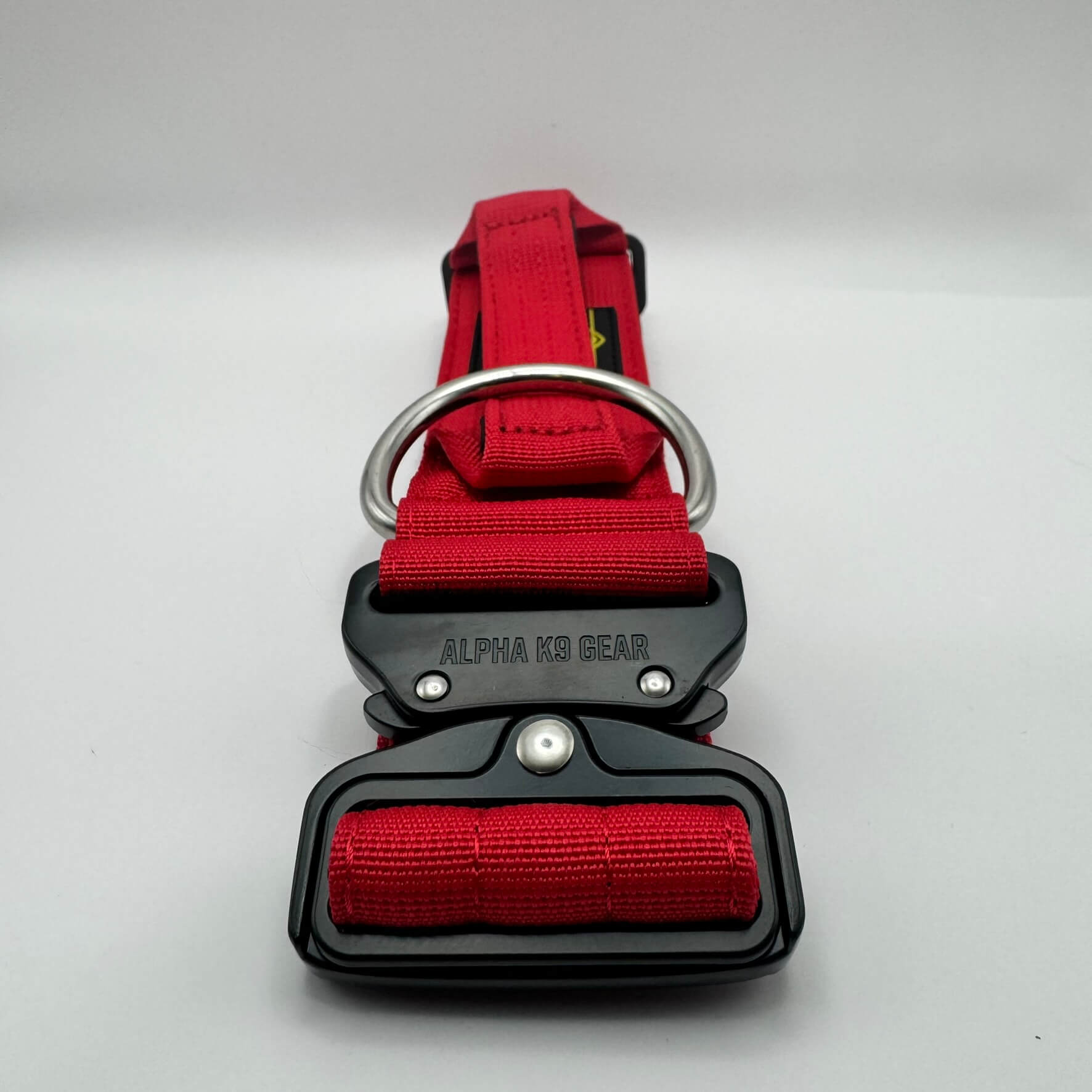 Official Alpha K9 Gear Red Tactical Dog Collar, featuring a signature heavy-duty quick-release metal buckle, reinforced control handle, and premium double-layered nylon engineered for large breeds