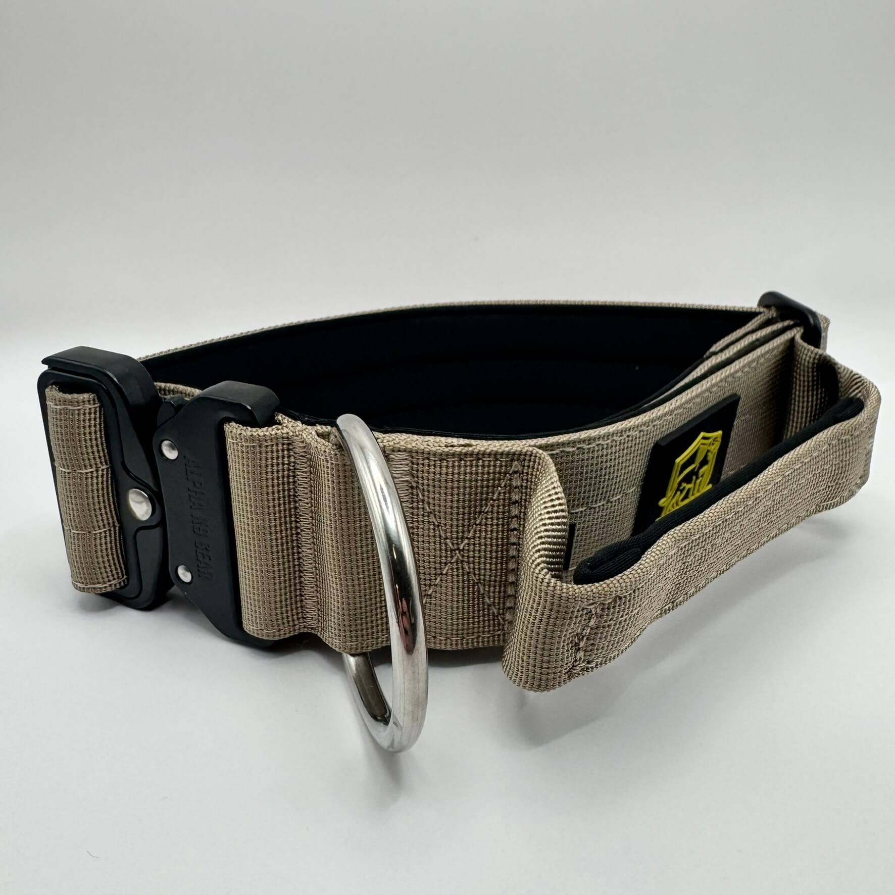 Beige Alpha K9 Gear tactical handle collar with reinforced stitching, quick-release metal hardware, and padded interior for maximum control of powerful dogs
