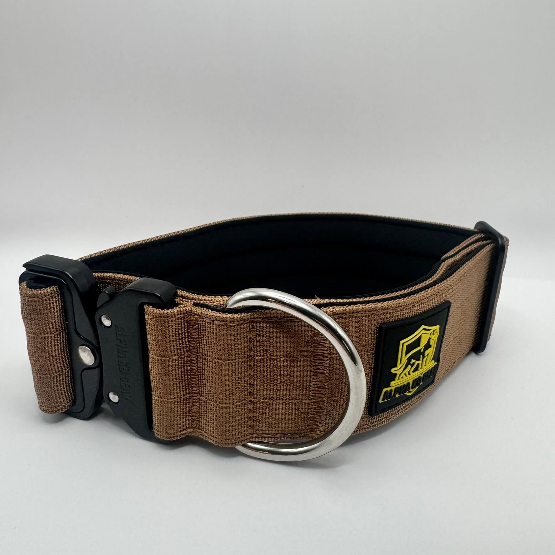 Brown heavy-duty tactical dog collar for large dogs, featuring high-strength nylon, quick-release metal buckle, and signature Alpha K9 Gear branding.