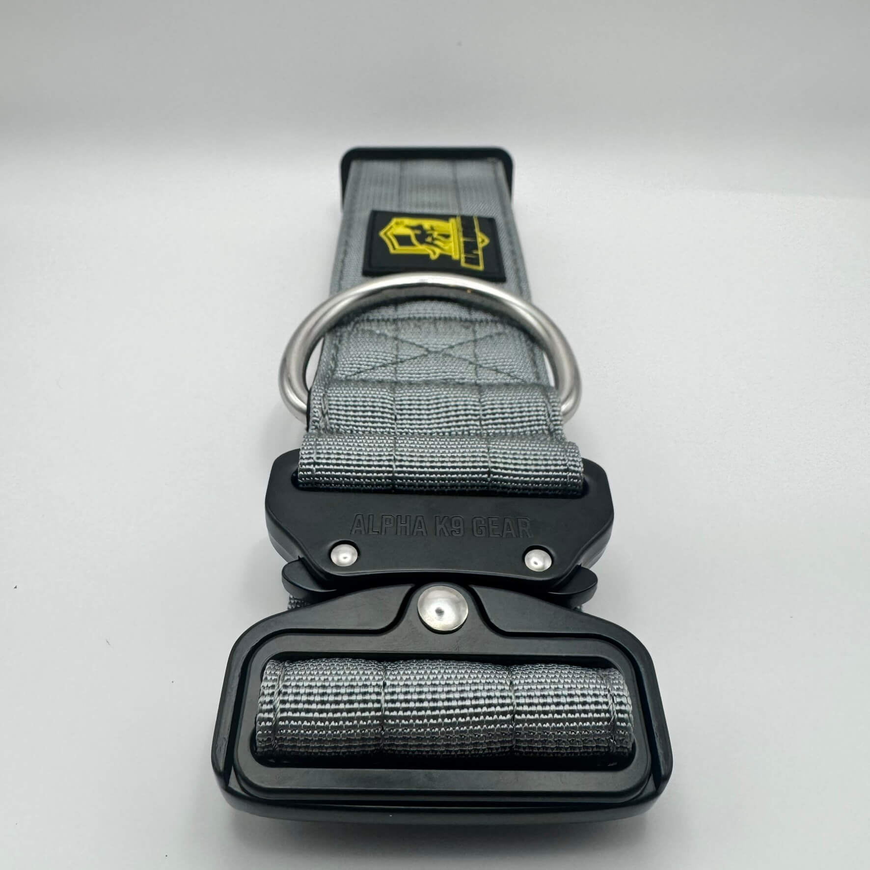Grey heavy-duty tactical dog collar for large dogs, featuring high-strength nylon, quick-release metal buckle, and signature Alpha K9 Gear branding.