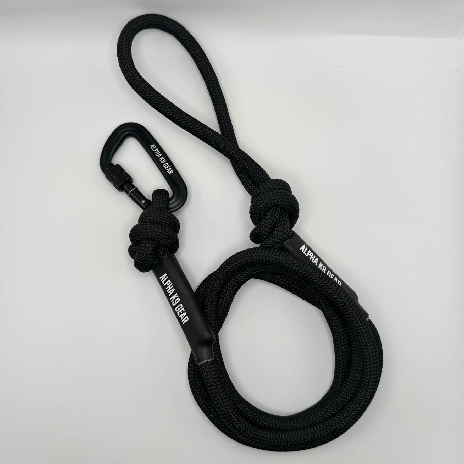 Black heavy-duty rope dog lead with secure black screw-gate carabiner and matching reinforced nylon collar for large, powerful dogs.
