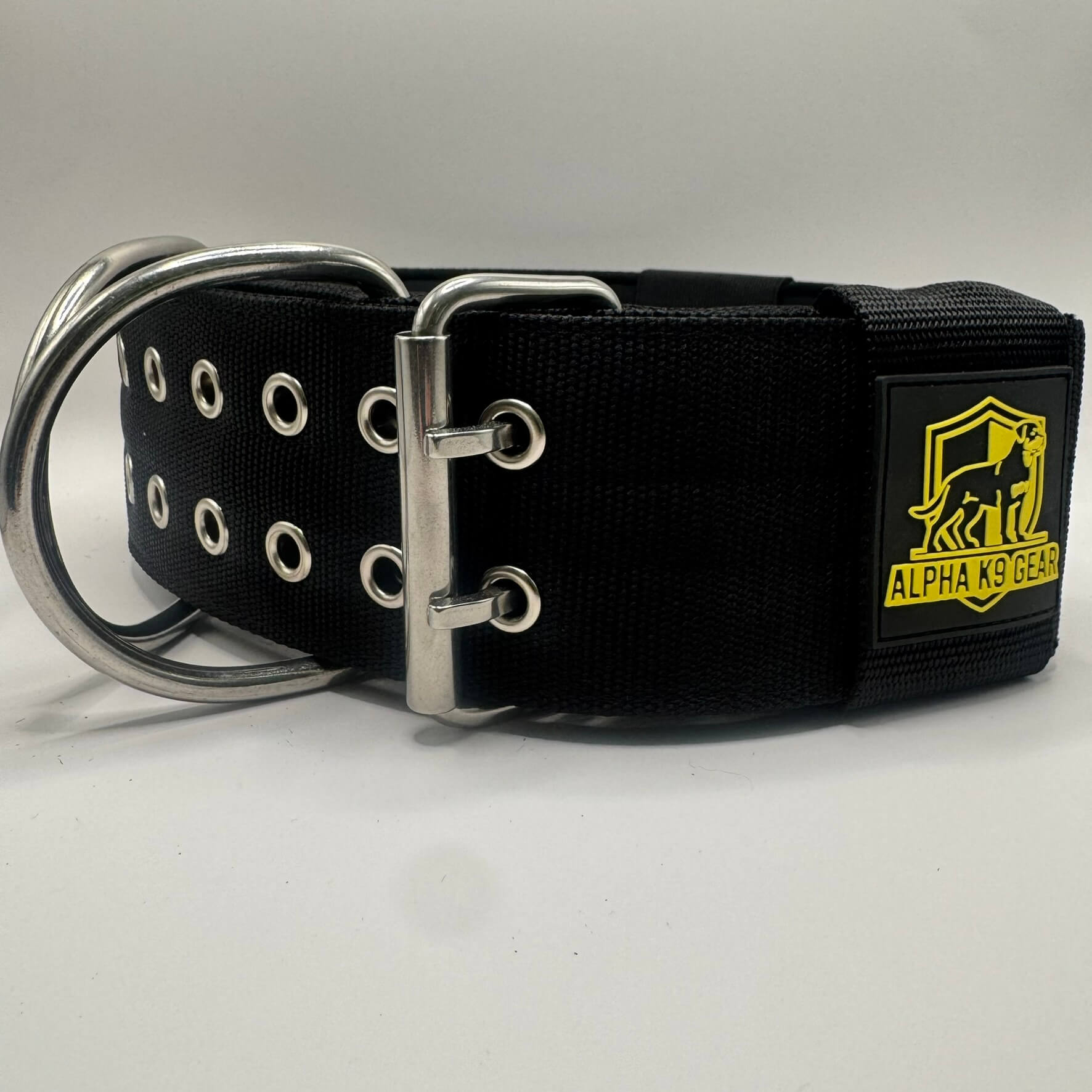 Official Alpha K9 Gear 7cm Extreme Heavy-Duty Dog Collar, featuring a massive 7cm wide profile, marine-grade stainless steel hardware, and thick internal padding. Specifically engineered for the world's most powerful breeds to provide maximum control, comfort, and unbreakable strength