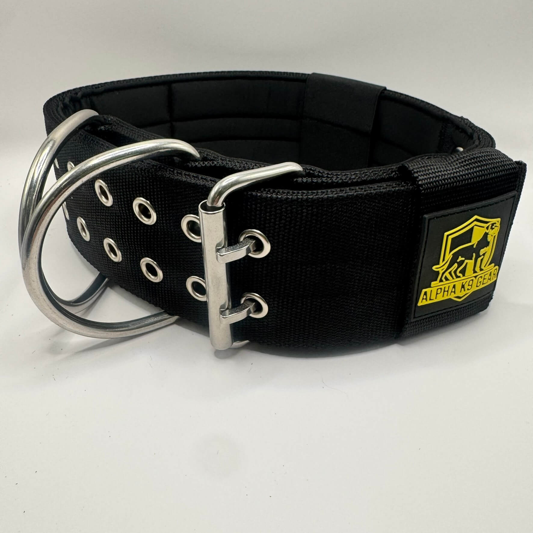 Official Alpha K9 Gear 7cm Extreme Heavy-Duty Dog Collar, featuring a massive 7cm wide profile, marine-grade stainless steel hardware, and thick internal padding. Specifically engineered for the world's most powerful breeds to provide maximum control, comfort, and unbreakable strength