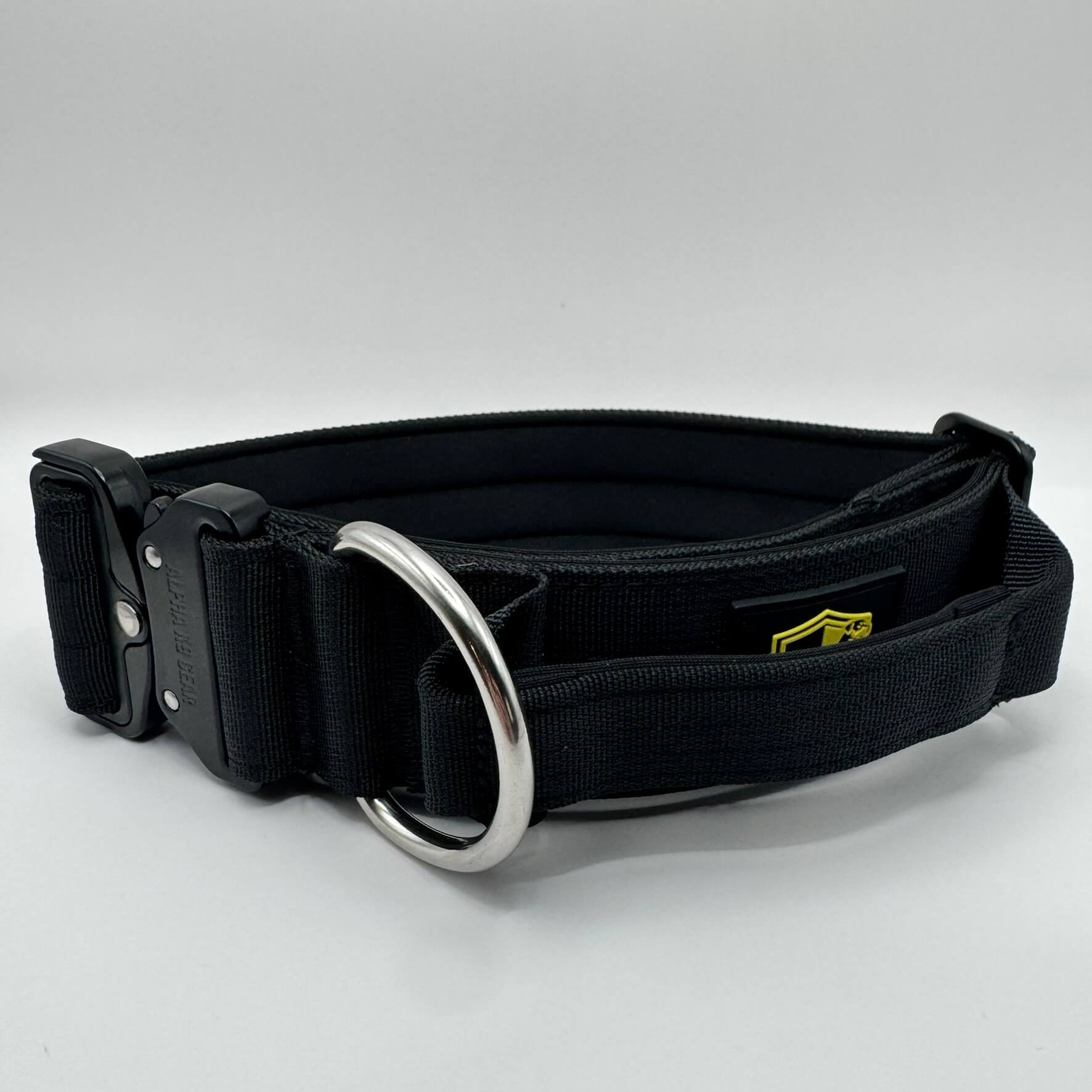 Official Alpha K9 Gear Black Tactical Dog Collar, featuring a signature heavy-duty quick-release metal buckle, reinforced control handle, and premium double-layered nylon engineered for large breeds