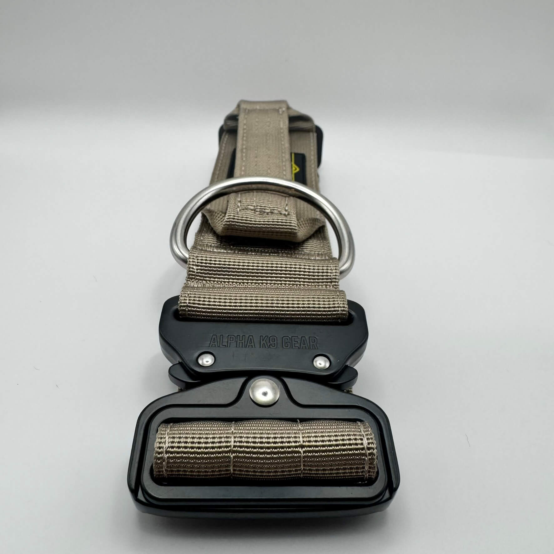 Official Alpha K9 Gear Beige Tactical Dog Collar, featuring a signature heavy-duty quick-release metal buckle, reinforced control handle, and premium double-layered nylon engineered for large breeds