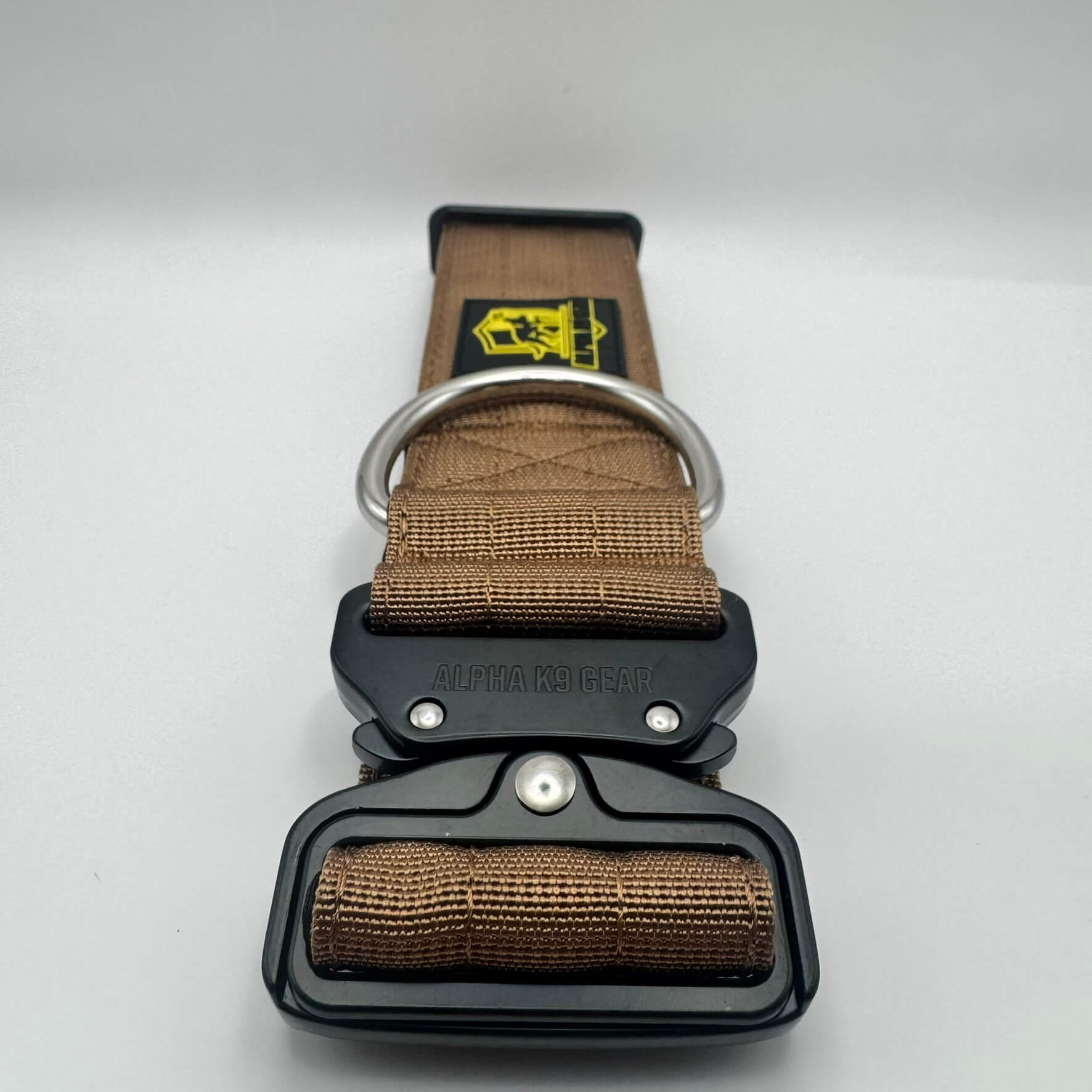 tan heavy-duty tactical dog collar for large dogs, featuring high-strength nylon, quick-release metal buckle, and signature Alpha K9 Gear branding.