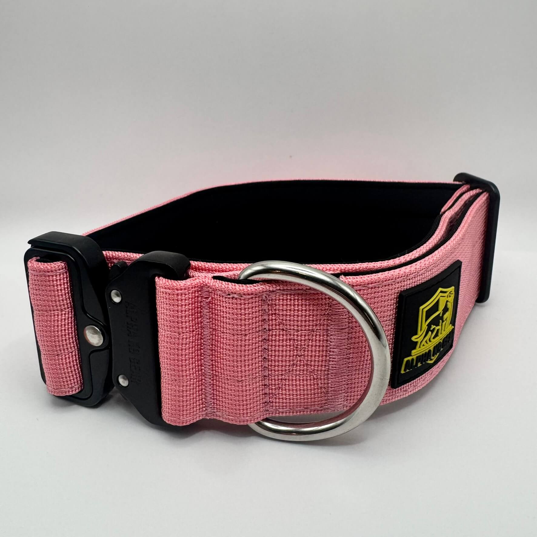 Pink heavy-duty tactical dog collar for large dogs, featuring high-strength nylon, quick-release metal buckle, and signature Alpha K9 Gear branding.