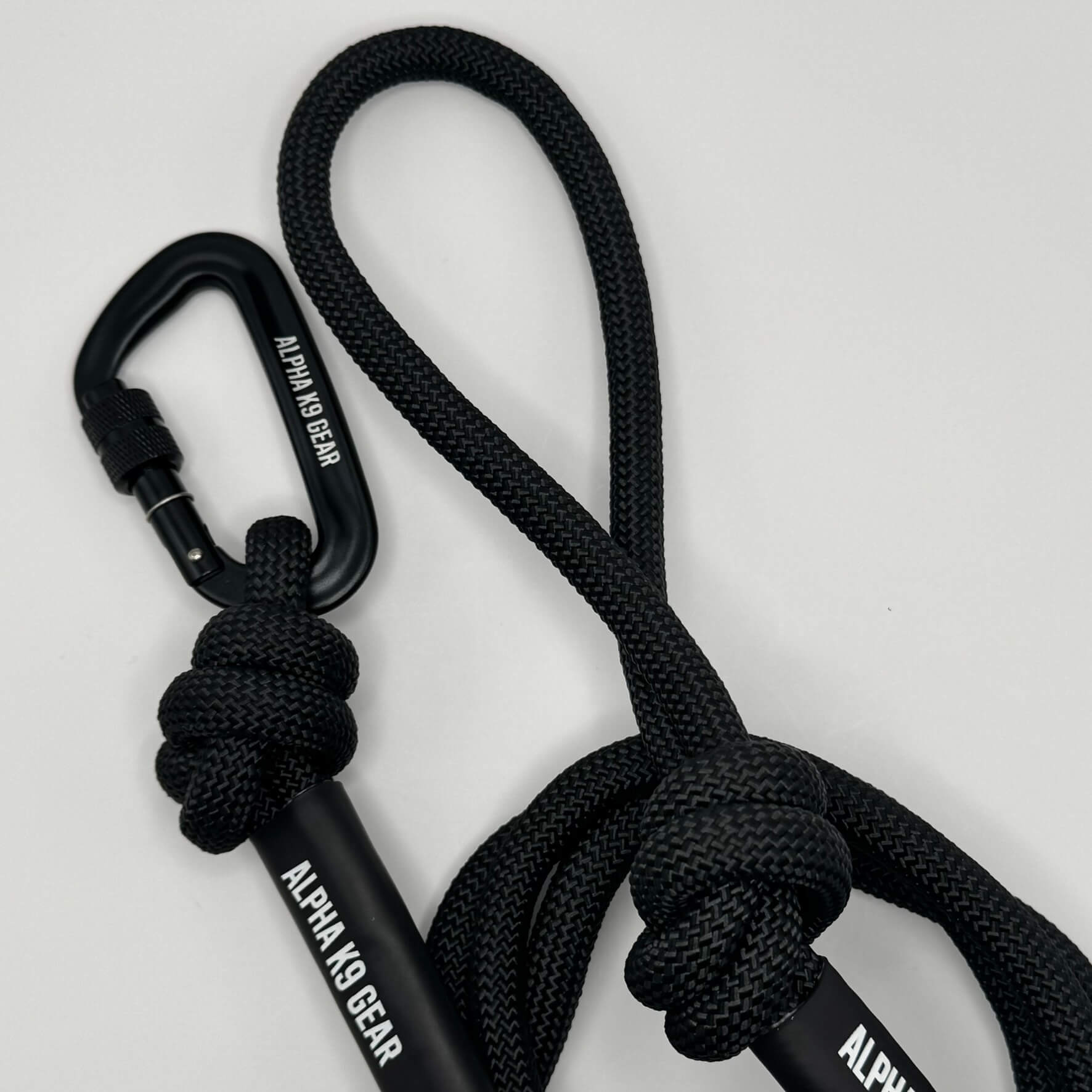 Black heavy-duty rope dog lead with secure black screw-gate carabiner for large, powerful dogs.